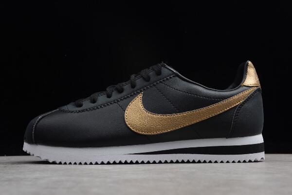 nike black and gold cortez trainers